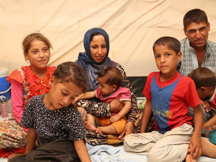 Familie aus Mossul mit ihren Kindern