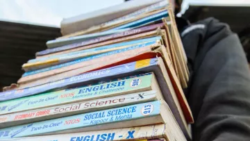 Youth with a bunch of books to study