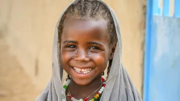 Kind aus einem World Vision Projekt, World Vision Jahresbericht 2024