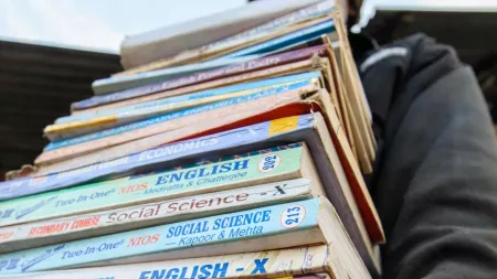 Youth with a bunch of books to study